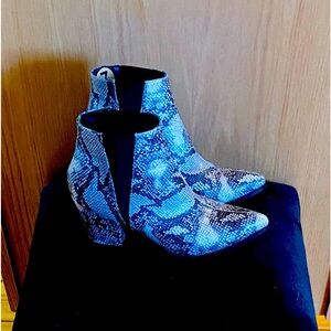Snake print boots. Never worn.